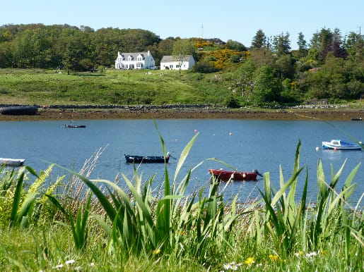 View of Ceomara Cottages from across Badachro Bay